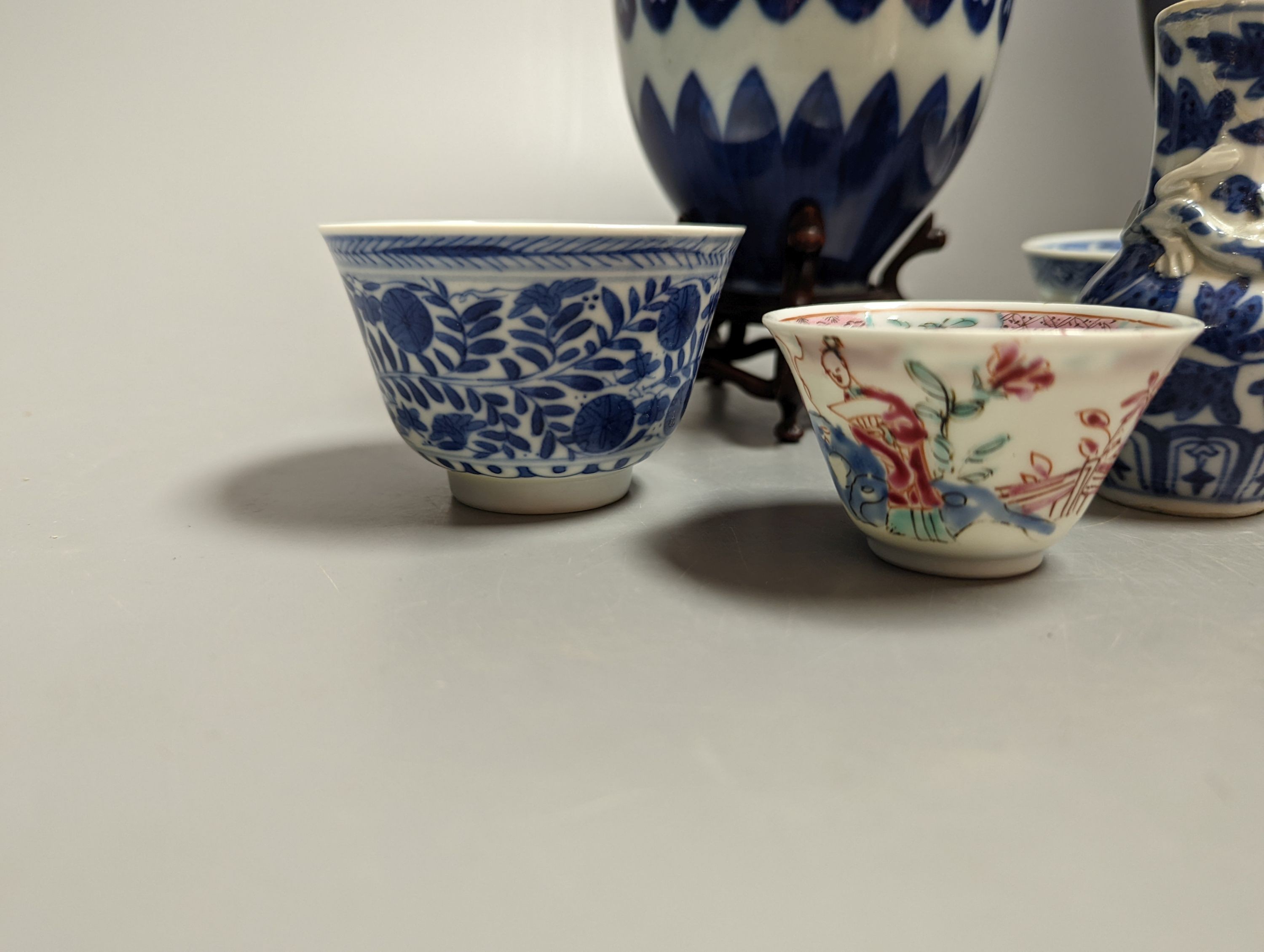 A Chinese blue and white bowl on stand, two tea bowls, miniature vase and an enamelled bowl, 18th-20th century